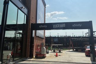 Xfinity FlockYard Graphics being installed by National Graphic Installations